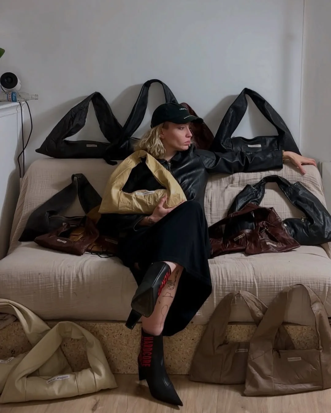 The maker sitting with the Ordinary bag family